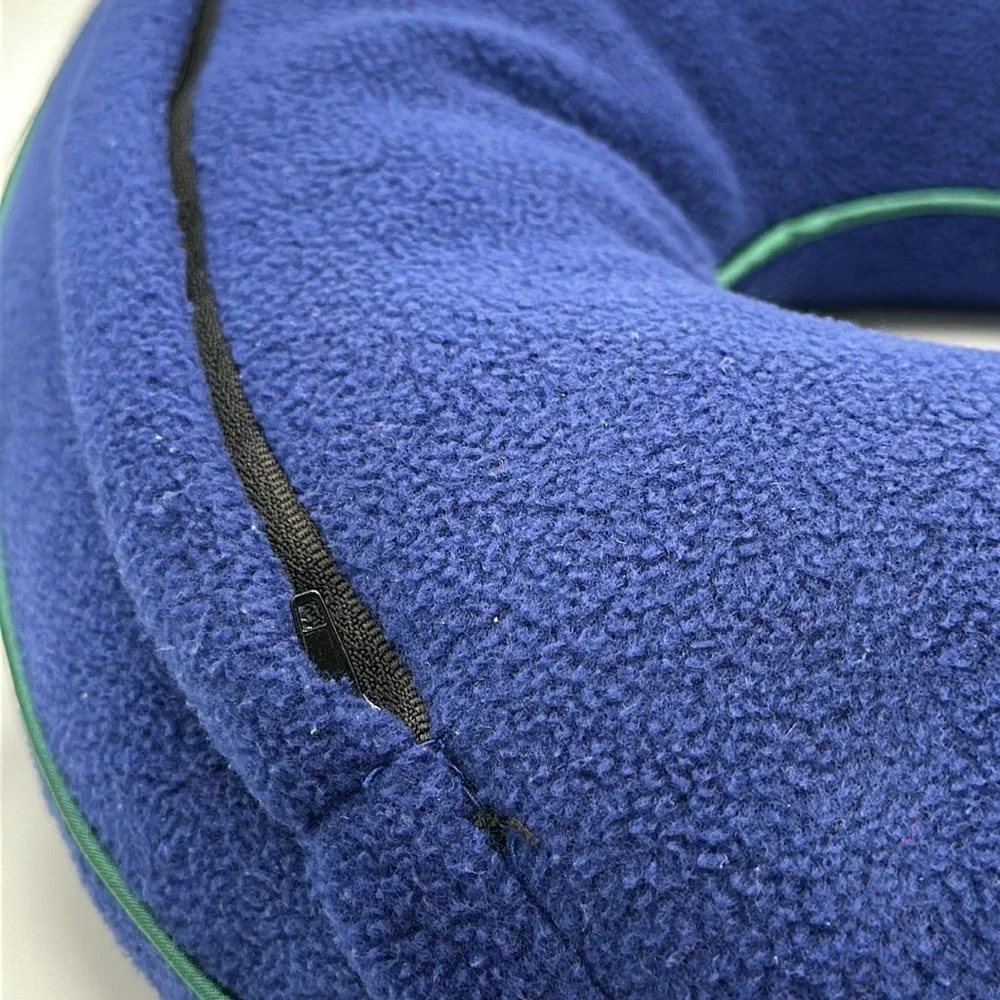 Austin House blue neck travel pillow with green piping